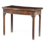 A GEORGE III MAHOGANY SERPENTINE CARD TABLE c.1770 the hinged fold-over top with a moulded edge on