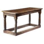 AN OAK REFECTORY TABLE 17TH CENTURY AND LATER the boarded top with cleated ends, above a lunette