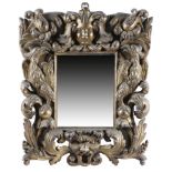 A CARVED GILTWOOD WALL MIRROR LATE 17TH / EARLY 18TH CENTURY the later rectangular plate within a