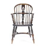 A 19TH CENTURY ASH AND ELM WINDSOR LOW BACK ARMCHAIR c.1850 with a pierced splat back on turned legs