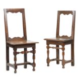 TWO SIMILAR OAK BACKSTOOLS EARLY 18TH CENTURY each with an open back with arc d'arbelete rails above