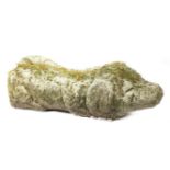 A CARVED STONE MODEL OF A SLEEPING DOG IN MEDIEVAL STYLE 65cm long