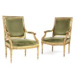 A PAIR OF GILTWOOD FAUTEUIL IN LOUIS XVI STYLE 19TH CENTURY the moulded frames carved with leaves,