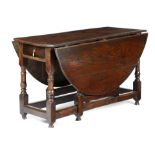 A QUEEN ANNE OAK GATELEG TABLE EARLY 18TH CENTURY the oval drop-leaf top above a single end frieze