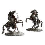 A PAIR OF BRONZE MARLY HORSE GROUPS LATE 19TH CENTURY after Guillaume Coustou (French 1677-1746), on