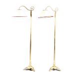 A PAIR OF BRASS STANDARD LAMPS LATE 19TH / EARLY 20TH CENTURY each with a scroll arm, a turned