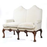 A MAHOGANY TWO SEATER SETTEE IN GEORGE II STYLE LATE 19TH / EARLY 20TH CENTURY the undulating padded