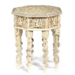 AN EASTERN PAINTED WOOD OCTAGONAL OCCASIONAL TABLE 20TH CENTURY encrusted with seashells and