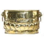 A DUTCH BRASS OVAL JARDINIERE LATE 19TH CENTURY repousse decorated with sailing ships and with