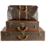TWO LOUIS VUITTON CANVAS SUITCASES c.1960 with brass mounts and locks, leather edging and