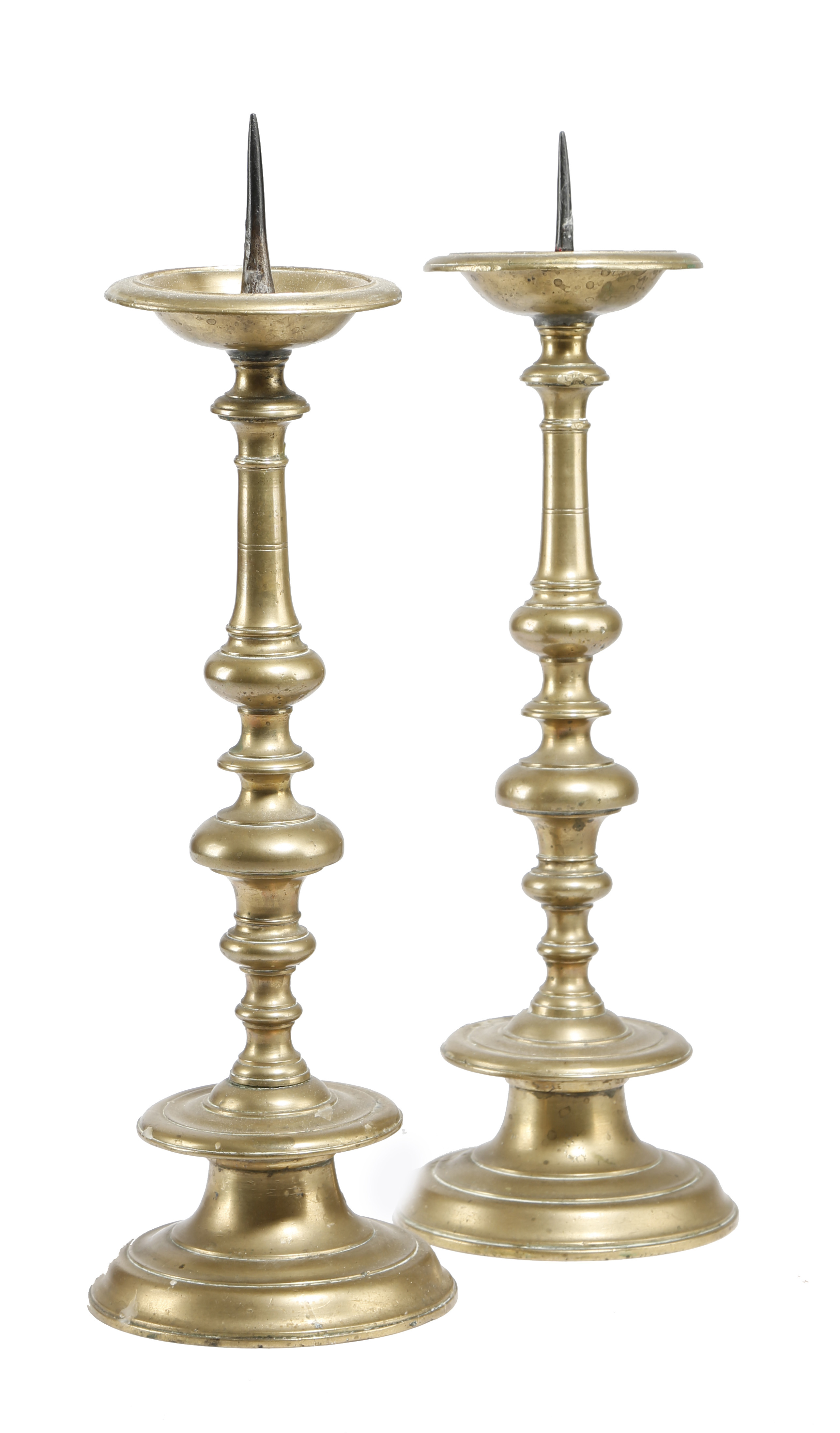 A PAIR OF FLEMISH BRASS PRICKET CANDLESTICKS LATE 17TH / EARLY 18TH CENTURY each with a dished