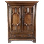 AN 18TH CENTURY FRENCH OAK ARMOIRE POSSIBLY NORMANDY with a moulded detachable cornice above a
