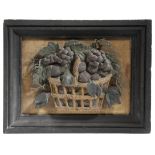 A 19TH CENTURY PAINTED PLASTER RELIEF OF A BASKET OF FRUIT c.1840 in an ebonised moulded frame 26