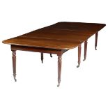 A GEORGE IV MAHOGANY EXTENDING DINING TABLE EARLY 19TH CENTURY AND LATER the reeded edge top with