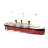A GERMAN TINPLATE CLOCKWORK MODEL OF AN OCEAN LINER BY BING c.1915-20 the hull, painted red and