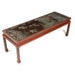 A RED LACQUER COFFEE TABLE 19TH CENTURY AND LATER the top inset with a panel taken from a Chinese
