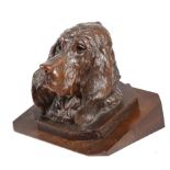 A BLACK FOREST CARVED WOOD HEAD OF A BLOODHOUND LATE 19TH CENTURY mounted on a walnut plinth 20.
