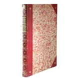 A RED LEATHER AND MARBLED PAPER FOLIO BOOK BOX PROBABLY FIRST HALF 20TH CENTURY the spine