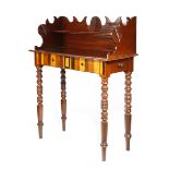 A 19TH CENTURY WEST INDIAN MAHOGANY CLERK'S TABLE PROBABLY JAMAICA the shaped raised back carved