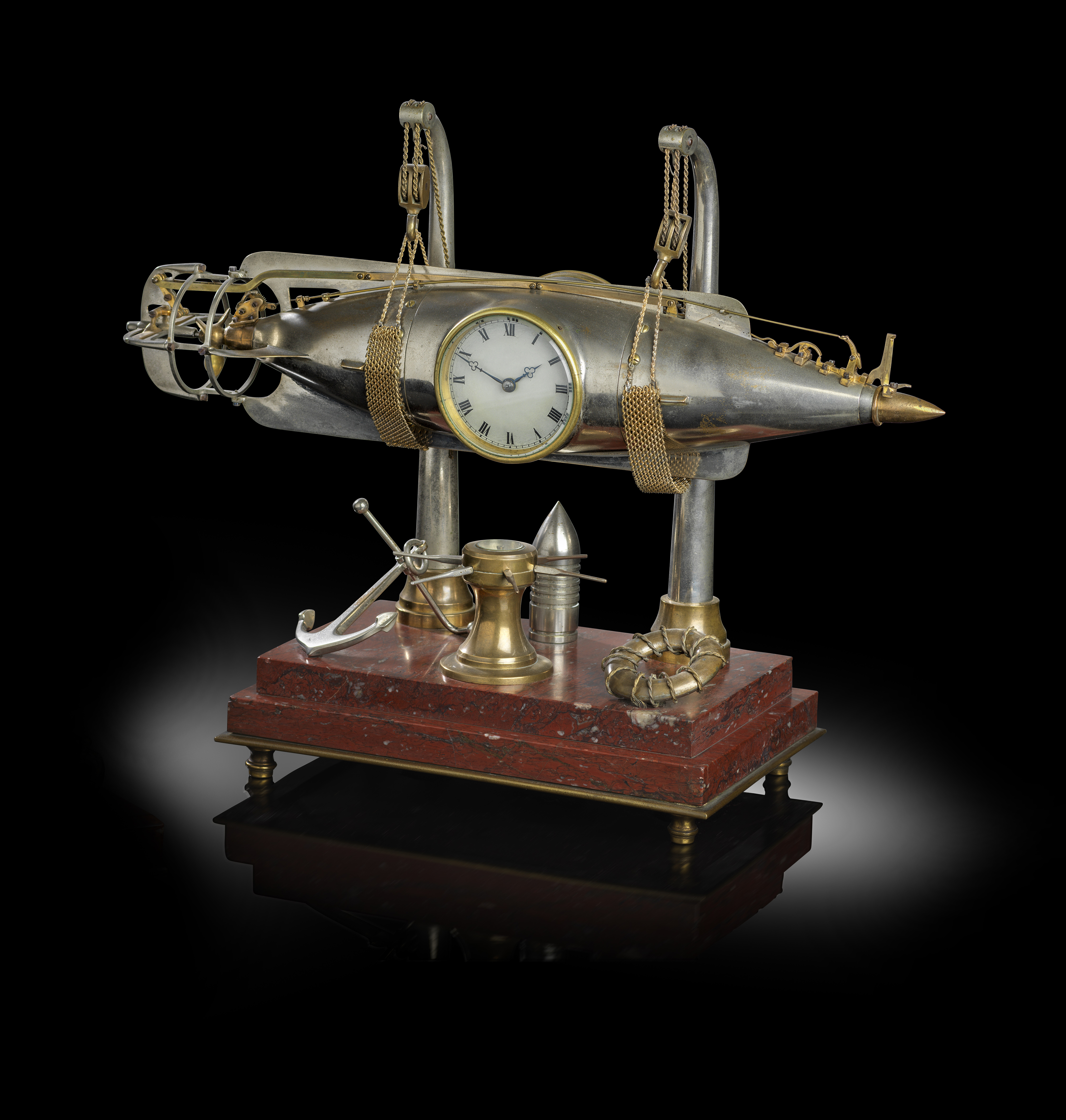 A RARE FRENCH BRASS AND SILVERED TORPEDO INDUSTRIAL TIMEPIECE WITH AUTOMATON LATE 19TH / EARLY