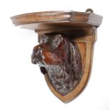 A VICTORIAN CARVED WOOD SPANIEL WALL BRACKET BY RALPH TUDSBERY NOTTINGHAMSHIRE, LATE 19TH CENTURY