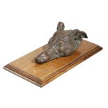 A PATINATED BRONZE DOG'S HEAD DESK PAPERCLIP LATE 19TH / EARLY 20TH CENTURY in the form of a