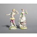 An early pair of Derby figures of dancers, c.1755-58, he wearing a pierrot-type costume with his