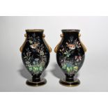 A pair of black glass enamelled vases, 2nd half 19th century, of flattened baluster form, painted