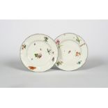 A pair of Chelsea plates, .1755, moulded in the Meissen Gotzkowsky manner with a central garland