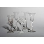 Four English wine glasses, c.1750-70, two with bell bowls above opaque twist stems, one with a