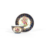 A rare Worcester teabowl and saucer, c.1765, painted with colourful fancy birds perched in and