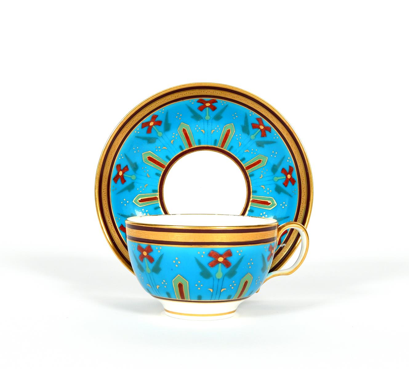 A Minton teacup and saucer, date code for 1870, boldly decorated in the Aesthetic manner with