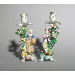 A near pair of Bow figural candlesticks, c.1760-65, emblematic of Summer and Autumn, the former