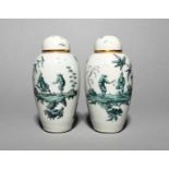 An interesting pair of English porcelain vases and covers, late 18th century, of ovoid form,