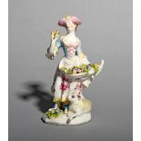 A Bow figure of a young girl, c.1756-58, possibly emblematic of Smell, holding a small posy of