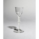 A wine glass, c.1760, with an ogee bowl raised on an opaque twist stem with central knop above a