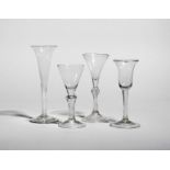 Four Continental wine glasses,, 18th century, one with a rounded funnel bowl raised on a six-sided