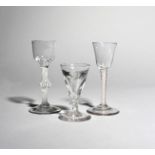Two wine glasses, c.1760, one with an ogee bowl above a knopped opaque twist stem, the other with