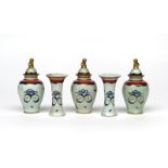 A Chinese porcelain five vase garniture, Qianlong 1736-95, comprising three baluster vases with