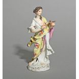 A Meissen Classical figure, mid 18th century, probably emblematic of the Arts, standing wearing