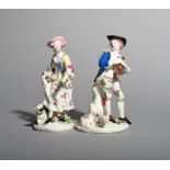 A pair of Bow figures of a Shepherd Piper and Dancing Shepherdess, c.1756, his pipes tucked under