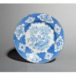 A Liverpool delftware plate, c.1760, painted in blue with a kylin seated on a square cushion