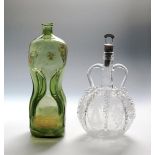 A Union decanter, c.1820, the tall pinched-waist form of a pale green metal, inscribed in gilt