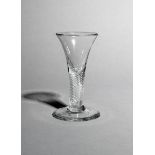 A small wine or dram glass, c.1750-60, with a drawn trumpet bowl rising from a thick airtwist