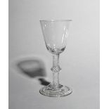 A large wine glass or goblet, c.1760, with a generous rounded funnel bowl raised on a knopped