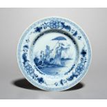 A delftware 'Dame au Parasol' plate, mid 18th century, painted in blue with a design after Cornelius