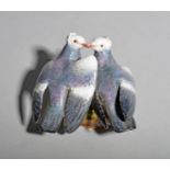 A Meissen group of pigeons, 19th century, the fancy birds billing with one enclosing the other's