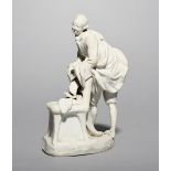 A Vienna biscuit porcelain figure of a courtier, c.1780, leaning on the back of a high-backed