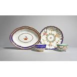 Two English porcelain teabowls and two dishes, c.1770-90, one teabowl Worcester and decorated with a