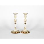 A large pair of Staffordshire enamel candlesticks, c.1770, the lobed bases painted with scenes of